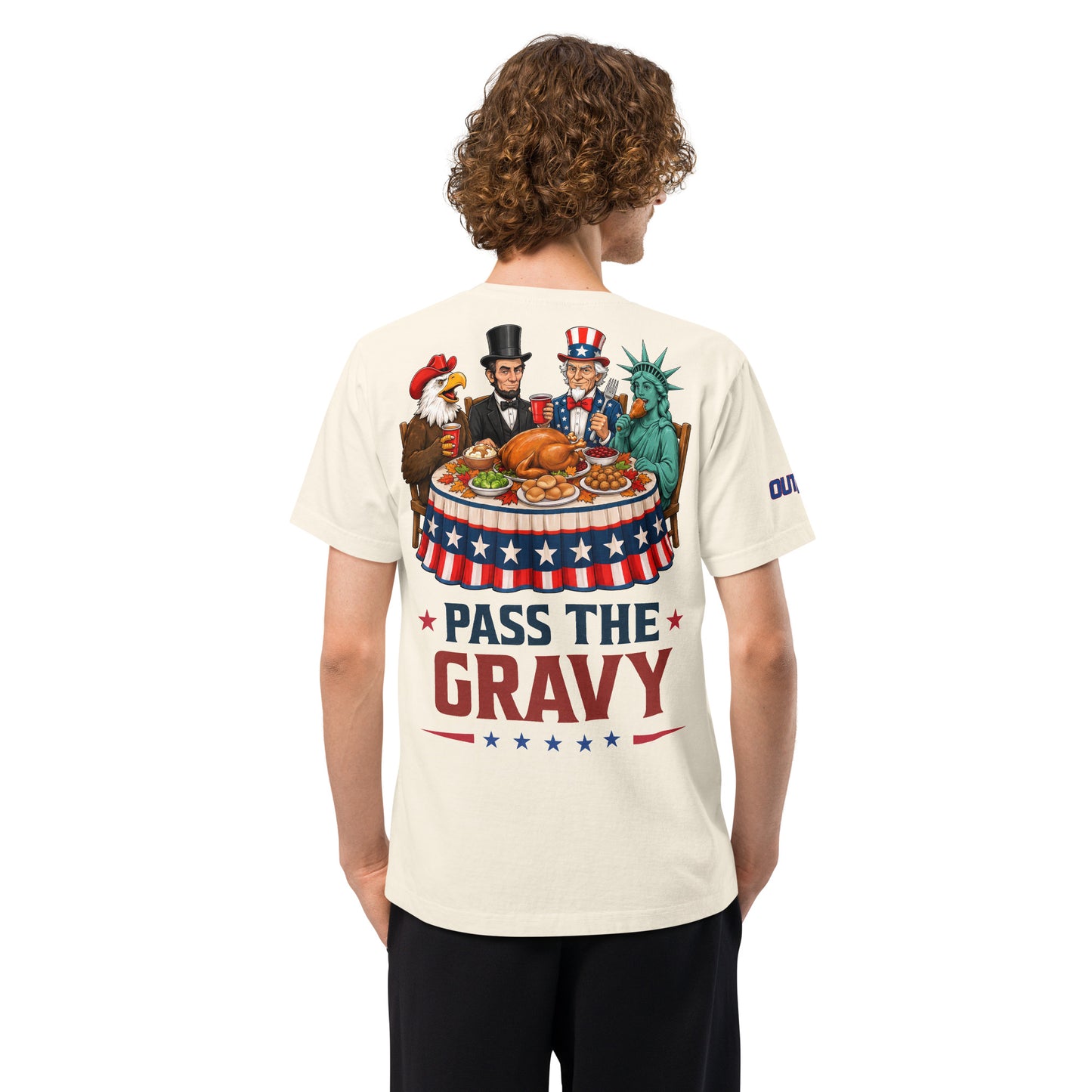 Close-up view of the bold Outkick Pass the Gravy graphic printed on the chest of the t-shirt.