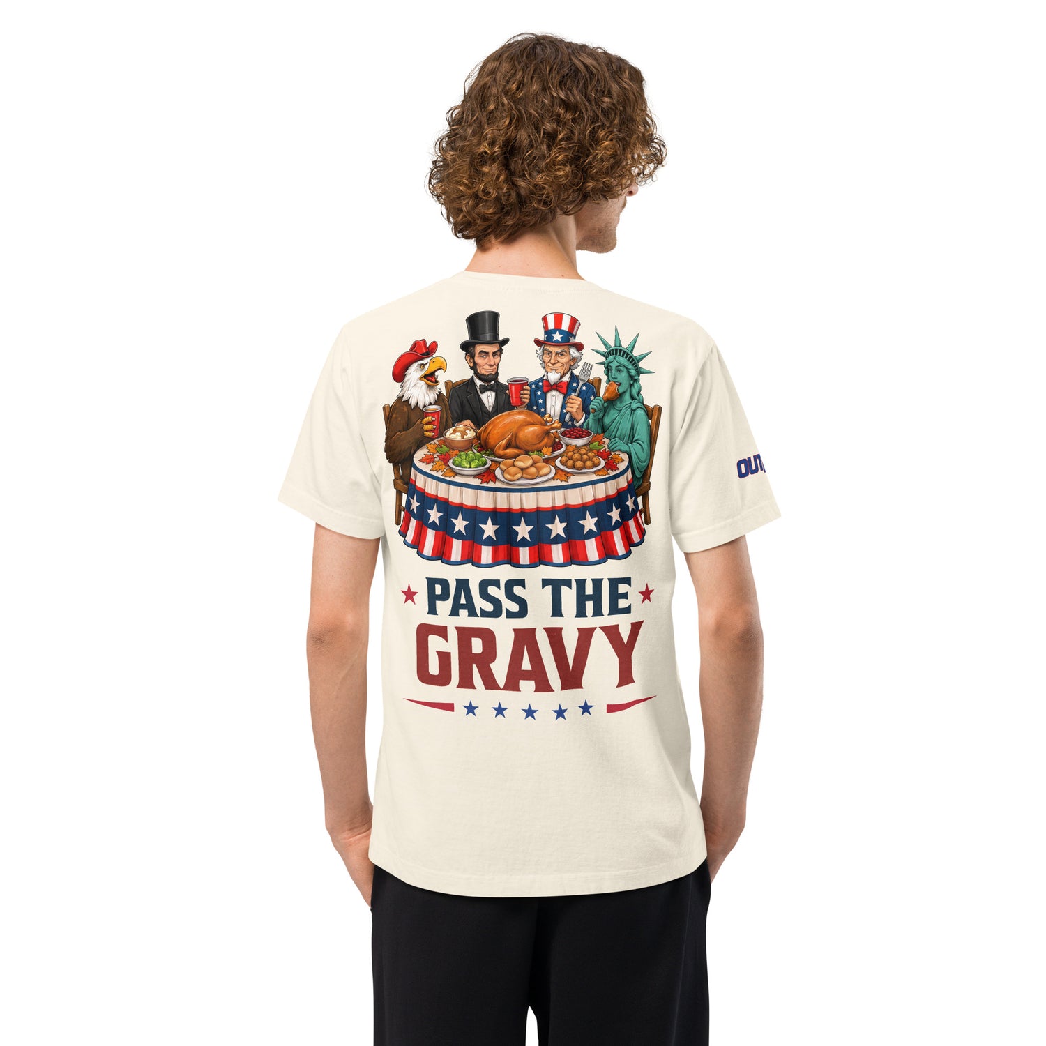 Close-up view of the bold Outkick Pass the Gravy graphic printed on the chest of the t-shirt.
